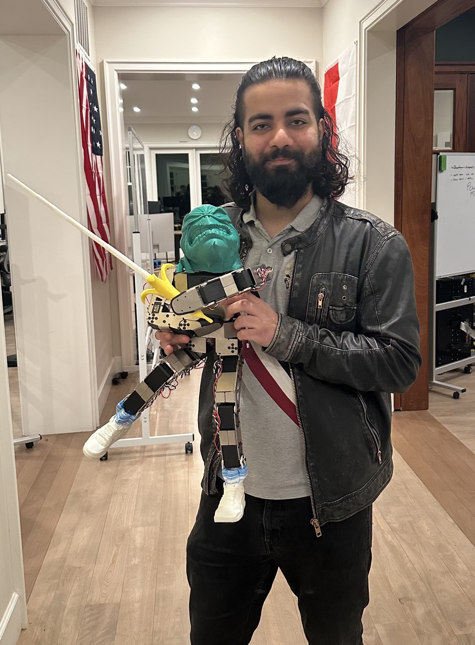 Izn E Allah holding a custom robot build